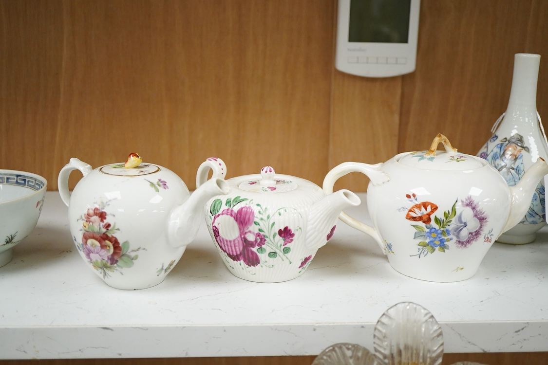 An 18th Furstenburg porcelain teapot and cover, a Wallendorf porcelain teapot and cover and a Meissen style teapot, 12cm high